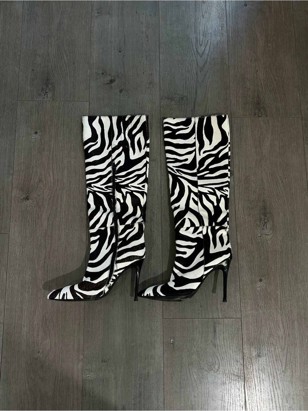 Jeffrey Campbell
Size: 7
Zebra Print Knee-High Stiletto Boots - Black & White